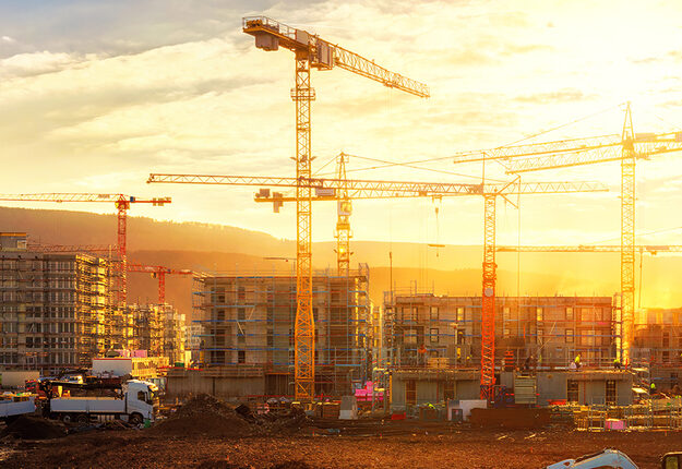 Cranes on a sky line on a construction site